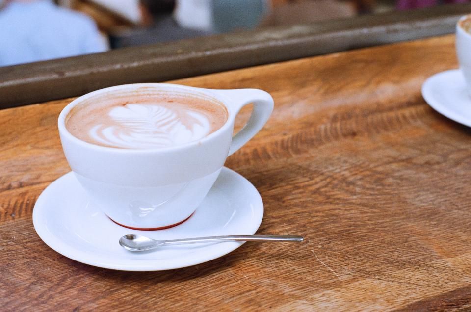 A latte on a wooden table