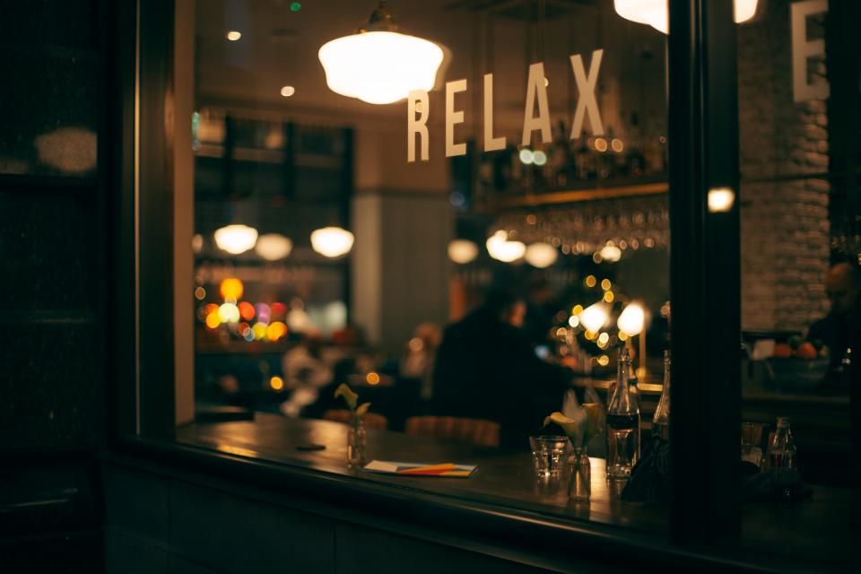 The bar seen through a window at night